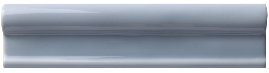 The Zephyr 2x8 Rail Molding Ceramic Tile features a glossy light gray finish, raised rounded edge, and smooth surface, capturing handcrafted Mediterranean style luxury on a white background.