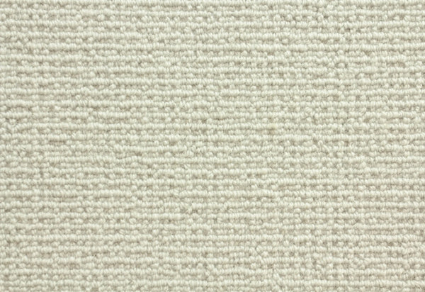 Close-up of Sequoia Berber Carpet in Barley, showcasing a textured, light beige surface with a repeating linear pattern made from tightly woven, premium fibers—ideal for durable flooring in high-traffic areas.