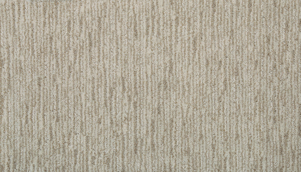 Close-up of Beautiful Elements Pet Friendly Carpet in Bisque, showcasing textured beige with subtle brown and tan stripes—perfect for those wanting durable, luxurious flooring that's also pet friendly.