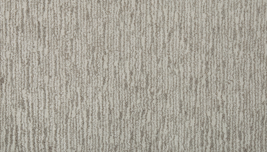 Close-up of Beautiful Elements Pet Friendly Carpet in Yearling, showing a textured surface with vertical, irregular gray lines on a light beige background for an elegant, organic look.