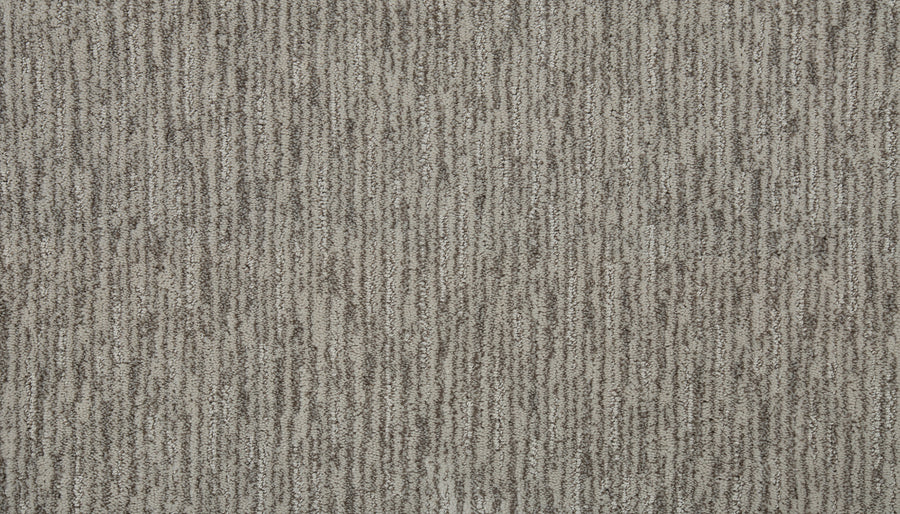 Close-up view of Beautiful Elements Pet Friendly Carpet in Fresh, featuring a textured beige and brown surface with subtle vertical stripes from alternating light and dark fibers, highlighting its durability and elegance.