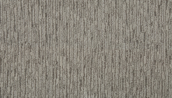 Close-up view of Beautiful Elements Pet Friendly Carpet in Fresh, featuring a textured beige and brown surface with subtle vertical stripes from alternating light and dark fibers, highlighting its durability and elegance.