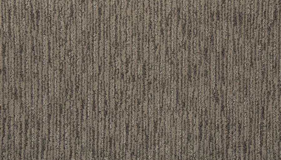 Close-up of Beautiful Elements Pet Friendly Carpet in At Rest, showcasing a textured surface with subtle vertical stripes in brown and beige tones—adding an elegant, luxurious touch to any space.