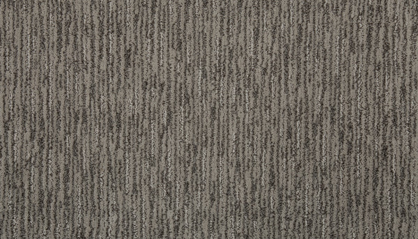 Close-up of Beautiful Elements Pet Friendly Carpet in Shale, featuring a textured gray surface with vertical dark and light stripes for a subtly luxurious look.