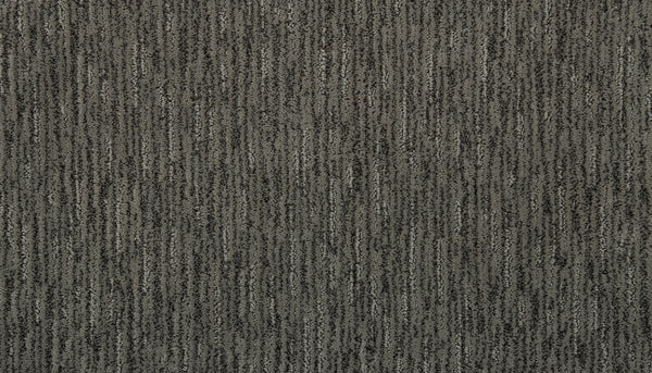 Close-up of Beautiful Elements Pet Friendly Carpet in Stone—a textured gray with vertical, slightly irregular lines in light and dark shades for a subtle striped look. Stylish and durable, it's designed to be pet friendly.