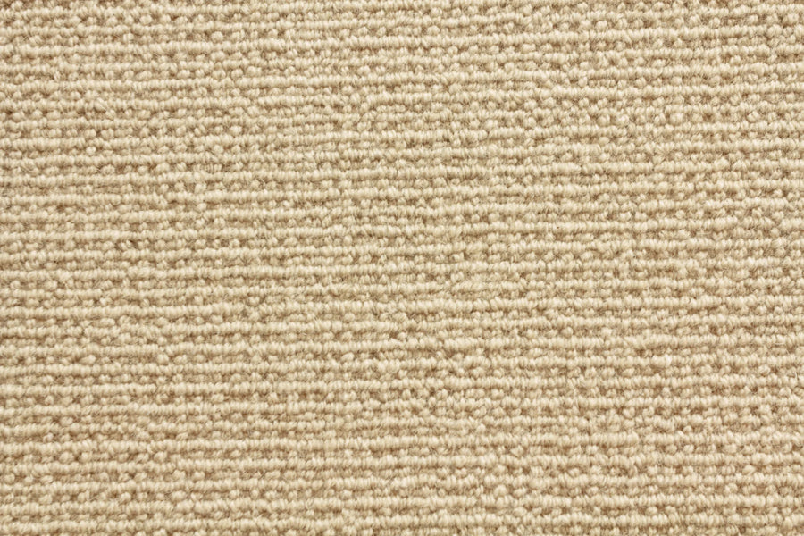 Close-up of Sequoia Berber Carpet in beige, featuring a tightly woven, looped pattern for durability and style—ideal for high-traffic areas.