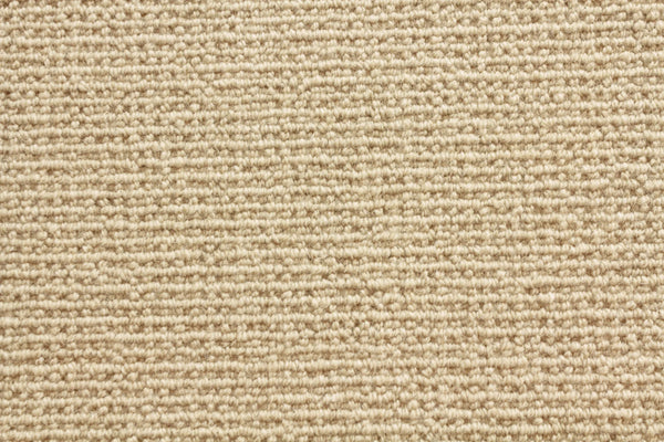 Close-up of Sequoia Berber Carpet in beige, featuring a tightly woven, looped pattern for durability and style—ideal for high-traffic areas.