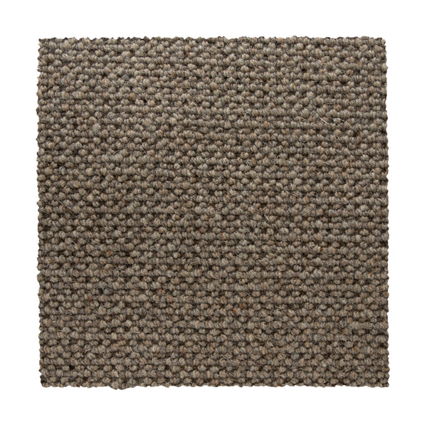 A square swatch of Bellarine Berber Carpet in Mineral, featuring tightly woven, textured loops, is displayed against a white background—a durable and stylish carpet option.