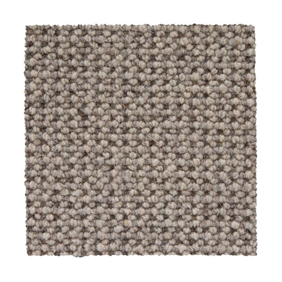 A square swatch of Bellarine Berber Carpet in Silverpointe shows a looped pattern with a thick, durable surface and soft, woven look—perfect for those wanting subtle style and lasting quality.