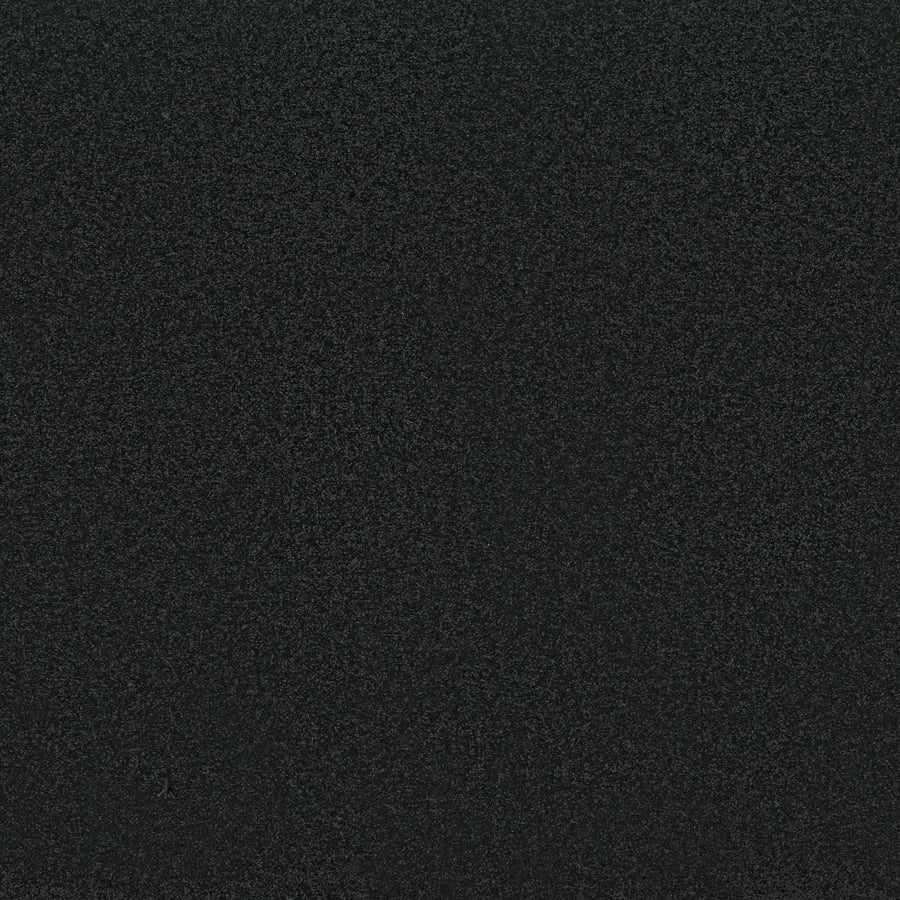 A close-up of Awaken Spirit Pet Friendly Carpet in Blackout reveals a dark, textured surface with a subtle speckled look, blending durability and contemporary style.