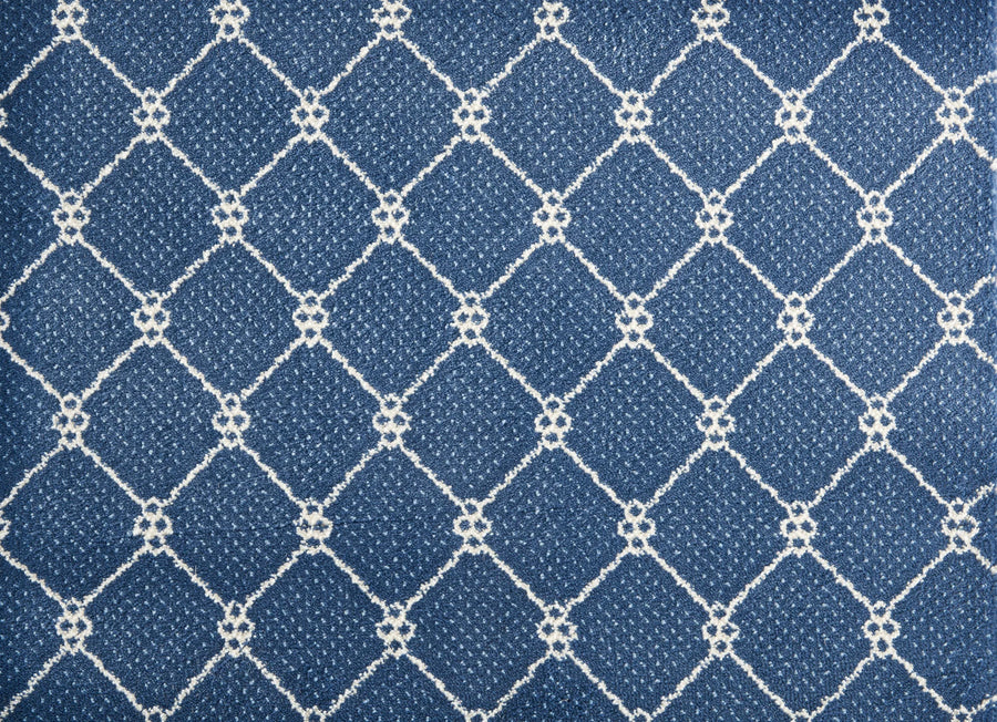 The Lake Boden Berber Carpet in Bluestone features a white diamond grid pattern with small loops at the intersections, offering a stylish and durable option for modern home flooring.