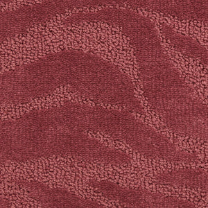 A close-up of Capetown On Trend Carpet in Bo-Kaap shows its textured maroon surface with subtle, wavy patterns from varied pile heights—ideal for high-traffic areas.