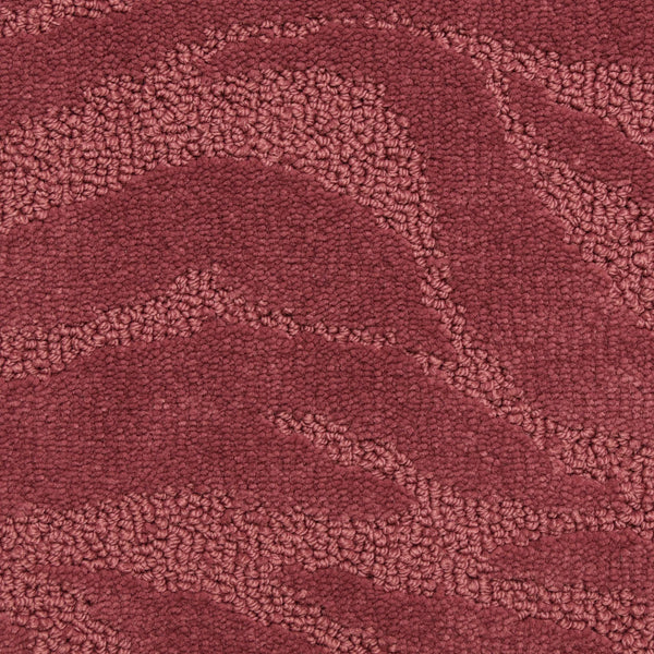 A close-up of Capetown On Trend Carpet in Bo-Kaap shows its textured maroon surface with subtle, wavy patterns from varied pile heights—ideal for high-traffic areas.