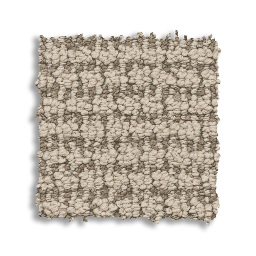 A square swatch of Laine On Trend Carpet shows a chunky woven texture in light beige and taupe, featuring an uneven edge and displayed on a white background.
