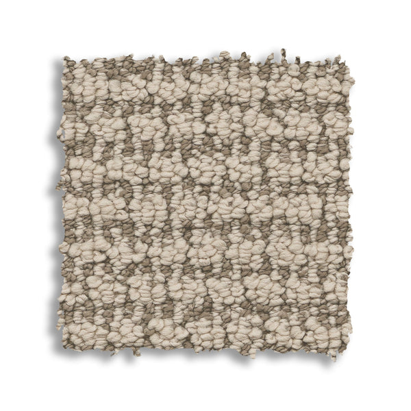 A square swatch of Laine On Trend Carpet shows a chunky woven texture in light beige and taupe, featuring an uneven edge and displayed on a white background.