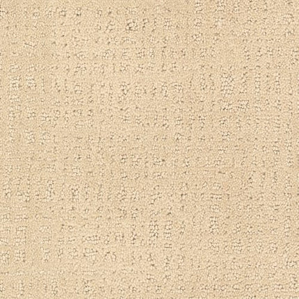 Homage Berber Carpet in Bon Ton features a beige textured fabric with a subtle, irregular pattern of small raised dots and lines—perfect for high-traffic areas while maintaining a soft, woven look.