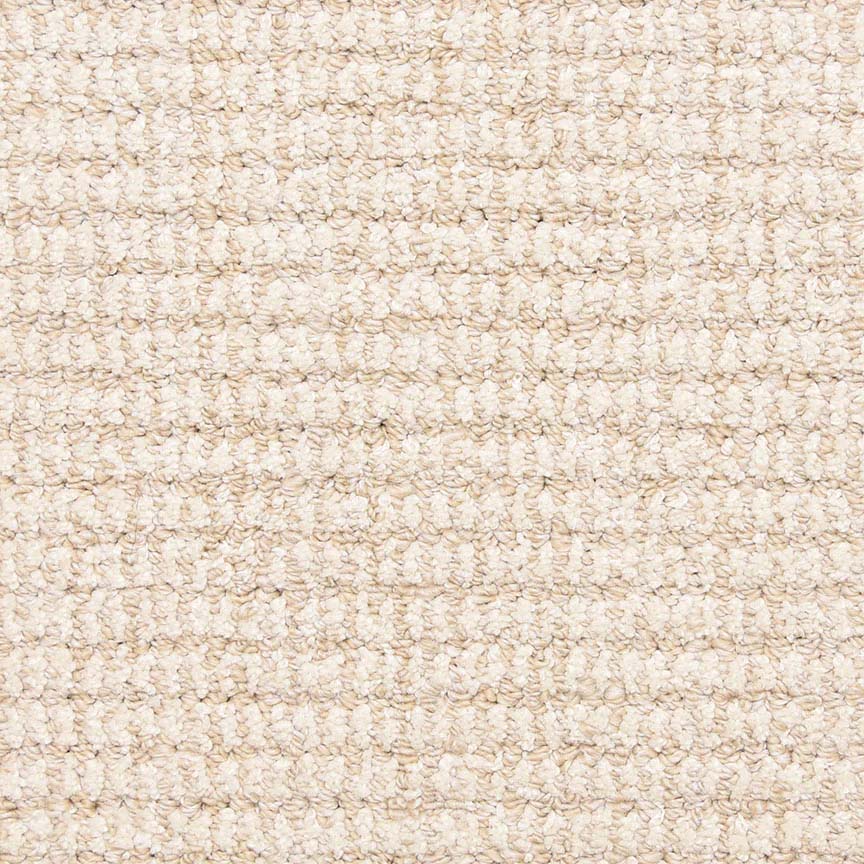 Close-up of Aspen Berber Carpet in Bone color, featuring a soft, tightly woven looped texture. The grid-like pattern highlights the carpet’s durability and uniform, stylish appearance.