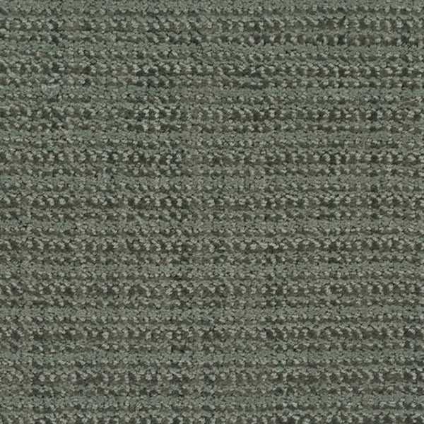 Close-up view of Beguiling Berber Carpet in Botanical color, showcasing its textured, looped style and subtle irregular grid pattern—a luxurious flooring choice with a modern touch.