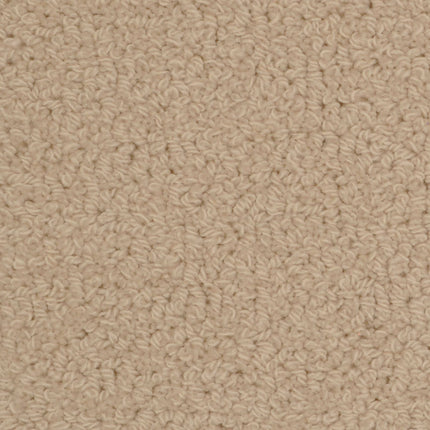 Close-up of Savant Berber Carpet in Bourdeaux shows a textured surface with tightly woven, small loops. The uniform Bourdeaux color and dense, soft material make it ideal for durable flooring in high-traffic areas.