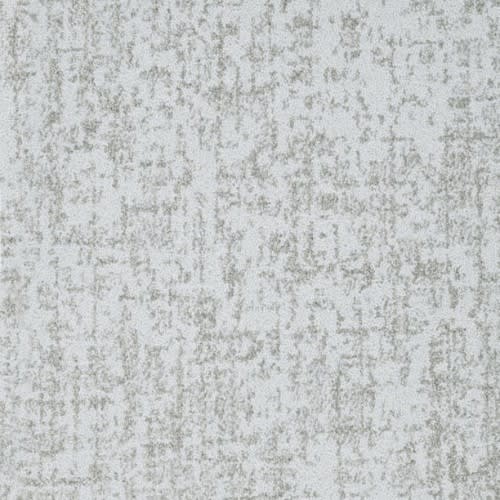 Hollywood Nights On Trend Carpet in Breeze features a light gray textured surface with mottled, darker gray patterns for a luxurious look and premium durability—ideal for anyone seeking stylish, on-trend flooring.