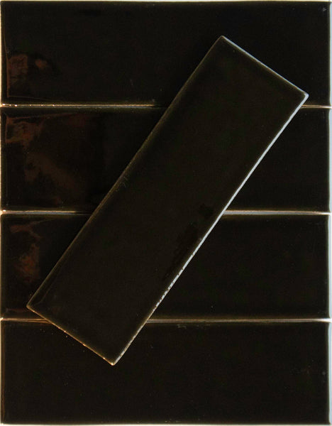 Five Noir Crackle 2.5x8 Ceramic Tiles in Brew-tiful are arranged horizontally, with a sixth tile placed diagonally on top.