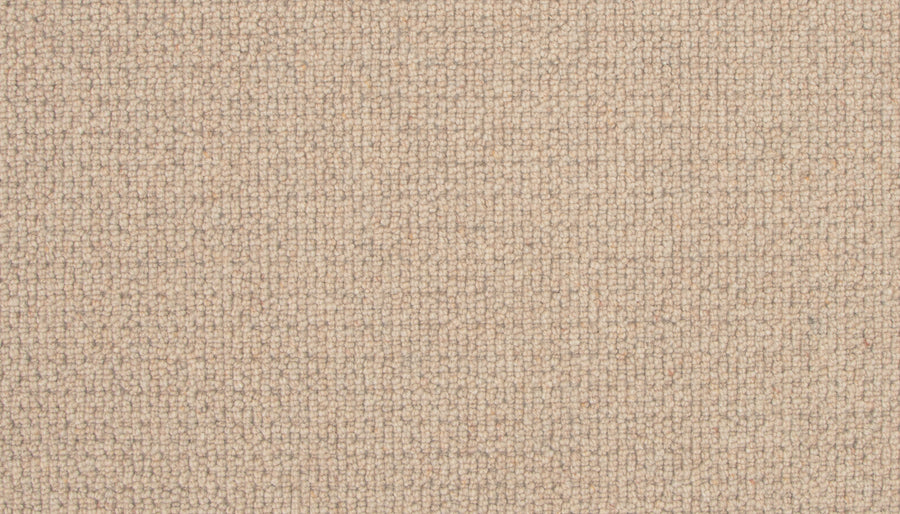 Close-up view of the Brixham Berber Carpet in Honeycomb, featuring small, tightly woven loops and a uniform, textured surface—a stylish and durable flooring option.