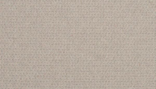 Close-up of the Brixham Berber Carpet in Canyon Fossil, featuring a light beige hue and woven grid-like texture. The soft, slightly rough surface displays visible threads that create a subtle, uniform patterned appearance.