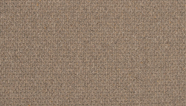 Close-up of Brixham Berber Carpet in Pioneer color, showing a soft, woolly texture and subtle grid-like weave. Durable material features small color variations throughout, adding depth to its brown surface.