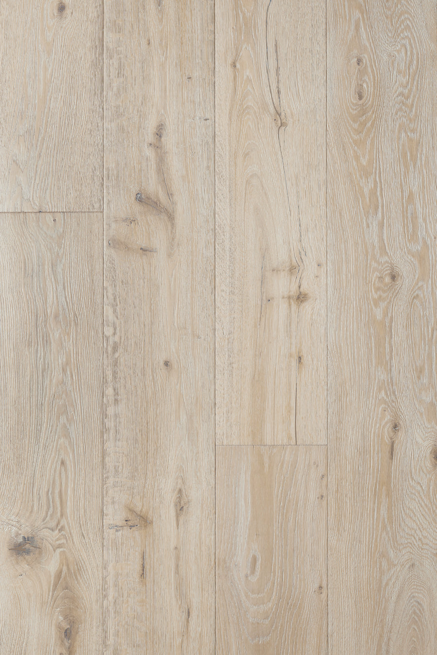 Villa Borghese 8" French Oak in Brunella features light-colored boards with natural grain and knots, arranged vertically. It has a rustic yet clean look and an ultra low gloss urethane finish for added scratch resistance.