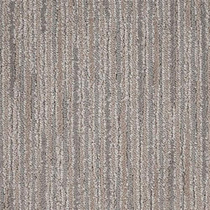 Close-up of Artist View On Trend Carpet in Brush Stroke, featuring a looped texture and vertical stripes in beige, gray, and light brown tones. Durable fibers provide a subtle, uniform, and neutral look.