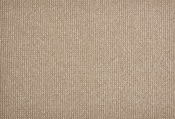 Close-up of Harper Berber Carpet in Buff—a beige, textured surface with subtle vertical stripes and a woven pattern. This soft, uniform carpet offers everyday durability and comfort, making it ideal for any space.