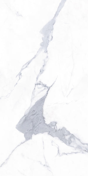 White marble surface with prominent gray veining running diagonally across the image, creating a natural, elegant pattern typically seen in stone countertops or flooring.