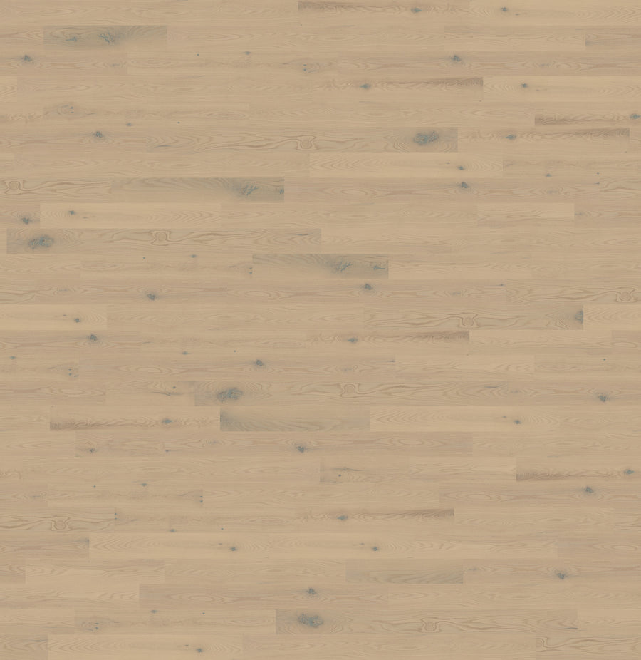 Carnaval 5 1/8" Red Oak Hardwood features a light hue, smooth finish, visible natural grain with small knots, and subtle tonal variations. Planks are laid in a classic staggered pattern for a timeless look.