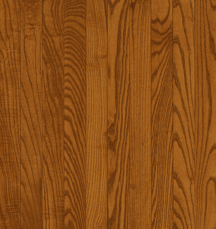 Close-up of Dundee 3 1/4" Red Oak Hardwood in Gunstock color, featuring a warm brown finish and natural vertical grain patterns characteristic of quality hardwood flooring.