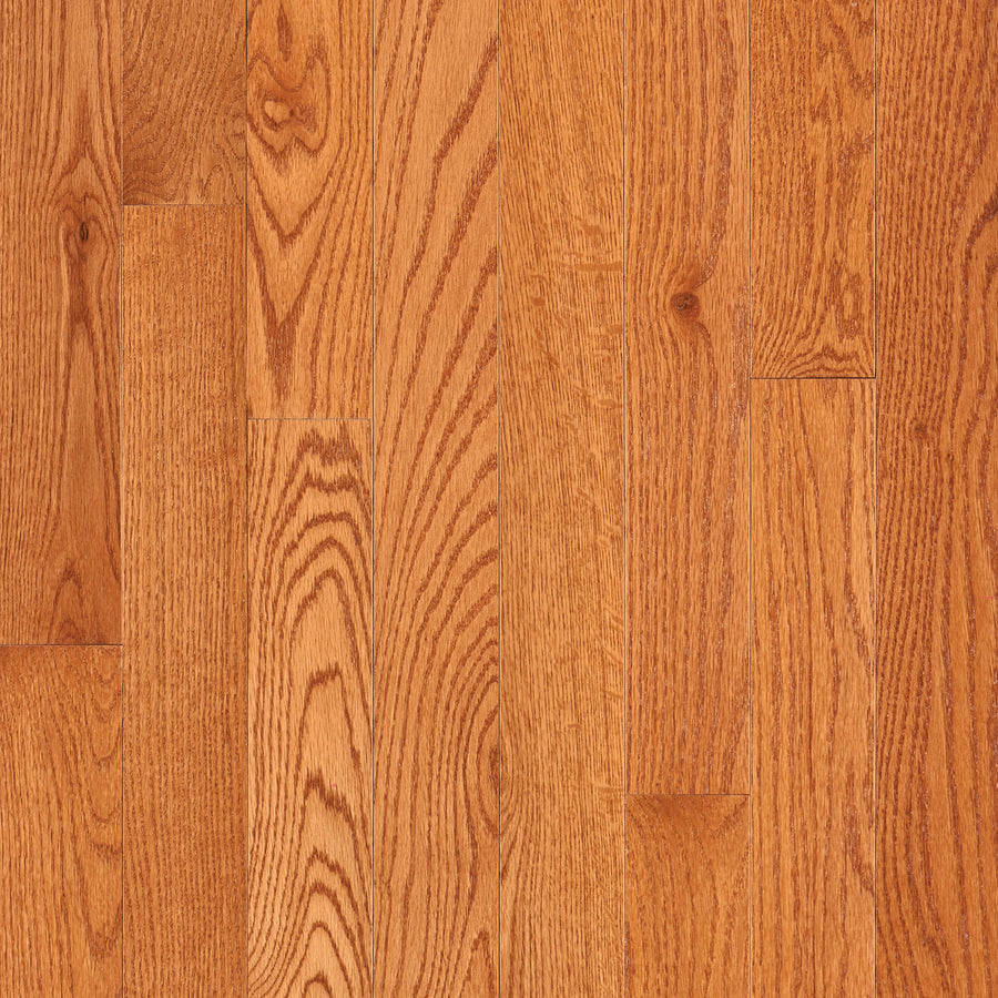 Close-up of Dundee 3 1/4" Red Oak Hardwood in Red Oak Butterscotch, showing several planks with unique wood grain patterns and natural texture variations.