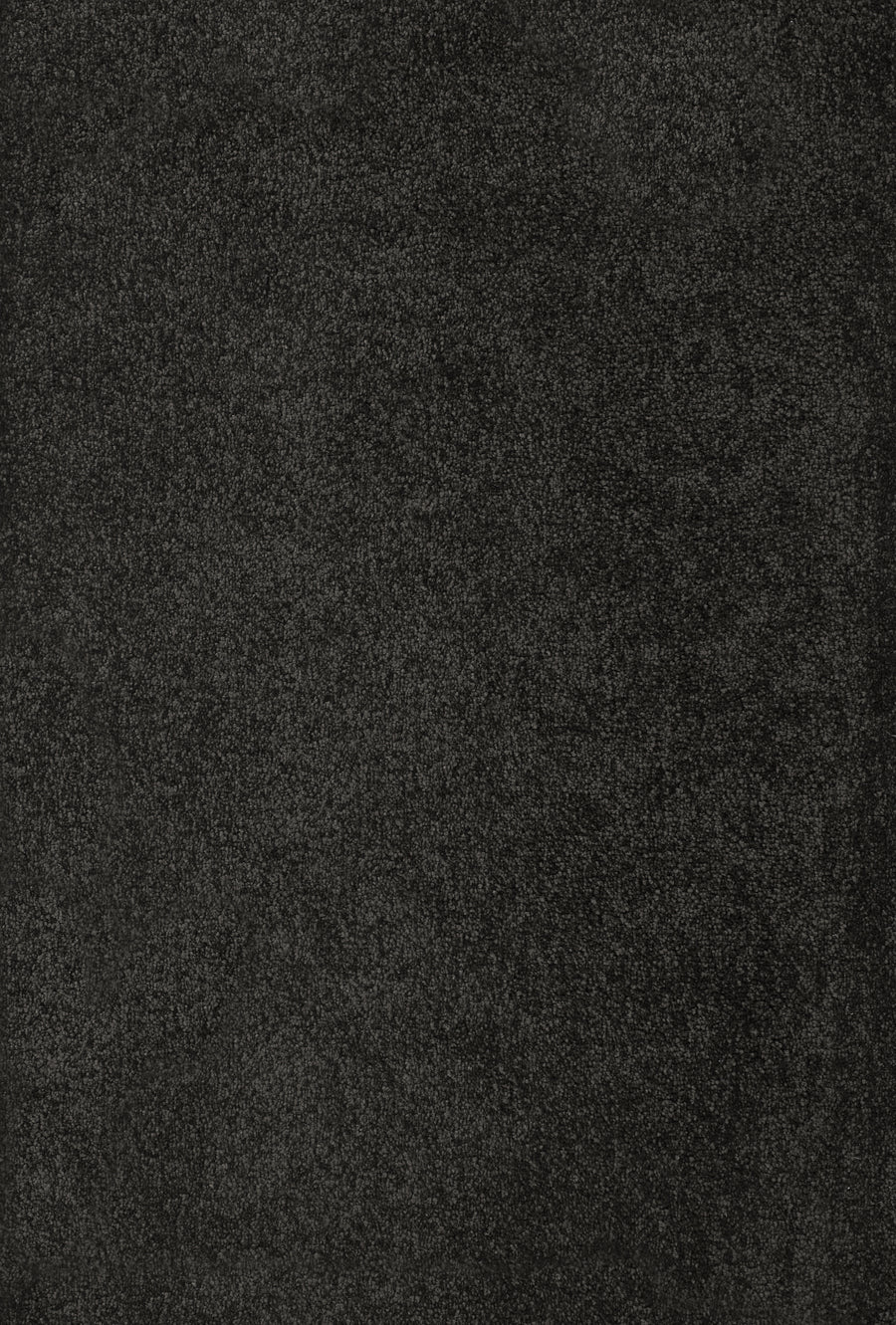 A close-up view of Divine Family Friendly Carpet in Midnight—a dark, textured surface resembling stone—perfect for luxury flooring that offers both style and durability.