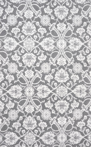 Vivar On Trend Carpet in Oyster features a delicate, symmetrical floral lace pattern with intricate flowers and leaves. The detailed, modern design repeats evenly across the surface for a contemporary look.