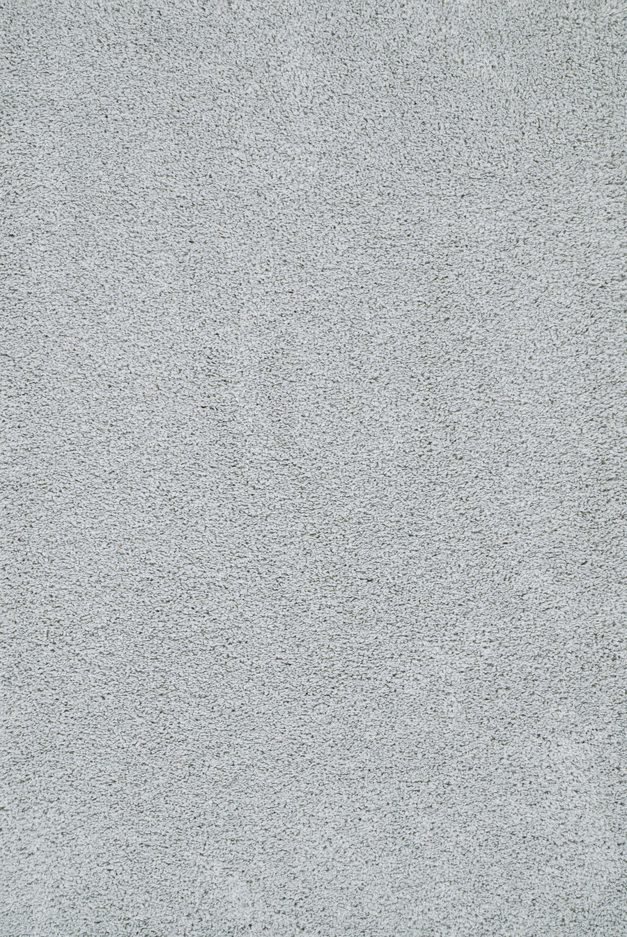 Close-up of Heavenly II Family Friendly Carpet in Sterling color, showing its soft, textured surface and dense fibers. The clean carpet appears uniform with subtle color variations from light and shadow.