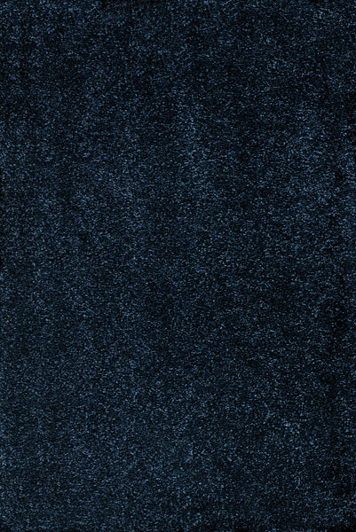 A close-up of the dark, textured Navy color of Heavenly II Family Friendly Carpet shows fine, densely packed speckles for a rough look—perfect inspiration for durable carpet in busy, high-traffic homes.