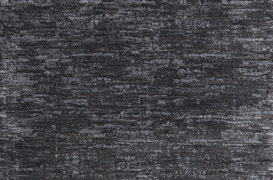 Olde Chatham On Trend Carpet in Charcoal offers a dark gray, textured surface with subtle, uneven patterns that evoke stone or fabric—its sophisticated look and durable finish make it ideal for luxury spaces and high-traffic areas.