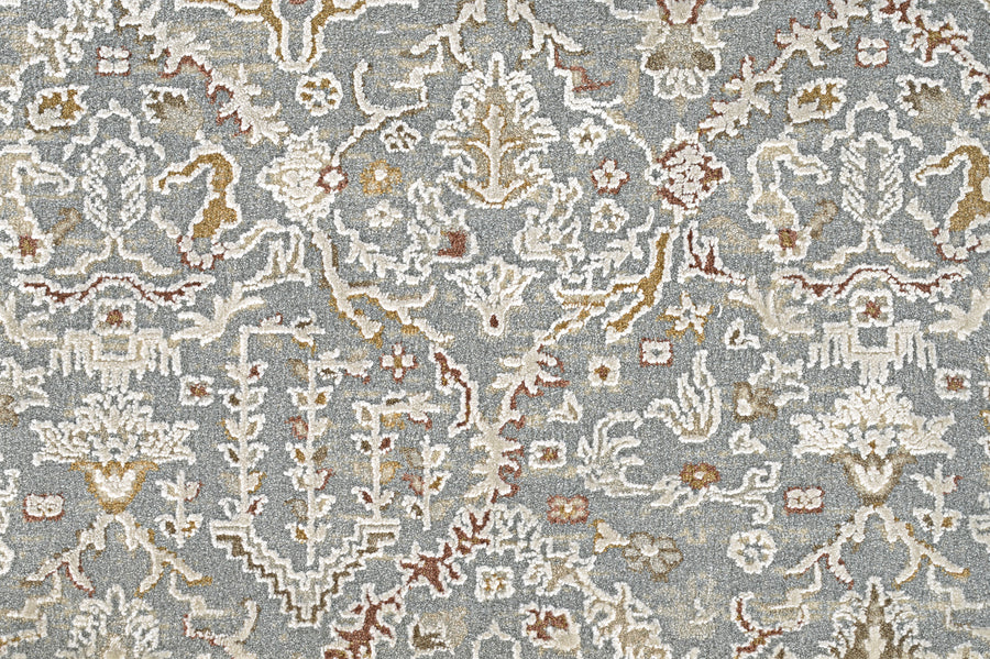 The Persian Damask On Trend Carpet features intricate floral and geometric motifs in shades of blue on a light background, offering a symmetrical, elegant look inspired by traditional Persian designs.