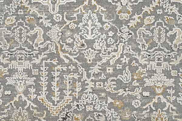 A close-up of the Persian Damask On Trend Carpet in dark gray shows its intricate, abstract floral and geometric damask pattern. The soft woven texture enhances the rug’s traditional elegance.