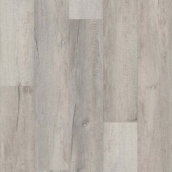 A close-up view of Coretec Pro Plus Vinyl flooring planks in light gray and beige tones, showing natural grain and texture. The rigid core planks are installed side by side in a staggered pattern.