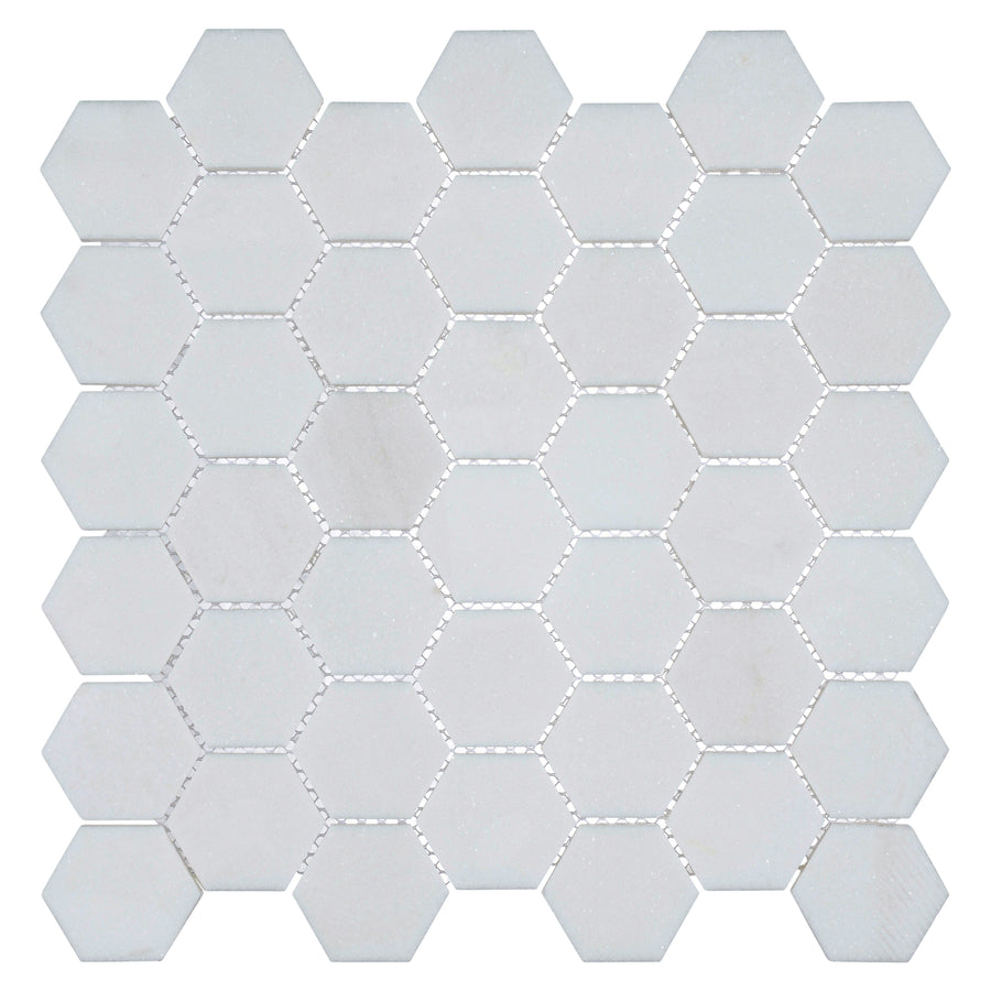 Colonial 2" Hexagon Ceramic Tile in Light Canopy displays elegant hexagonal geometry, arranged in a grid with thin grout lines and viewed from above on a white background.