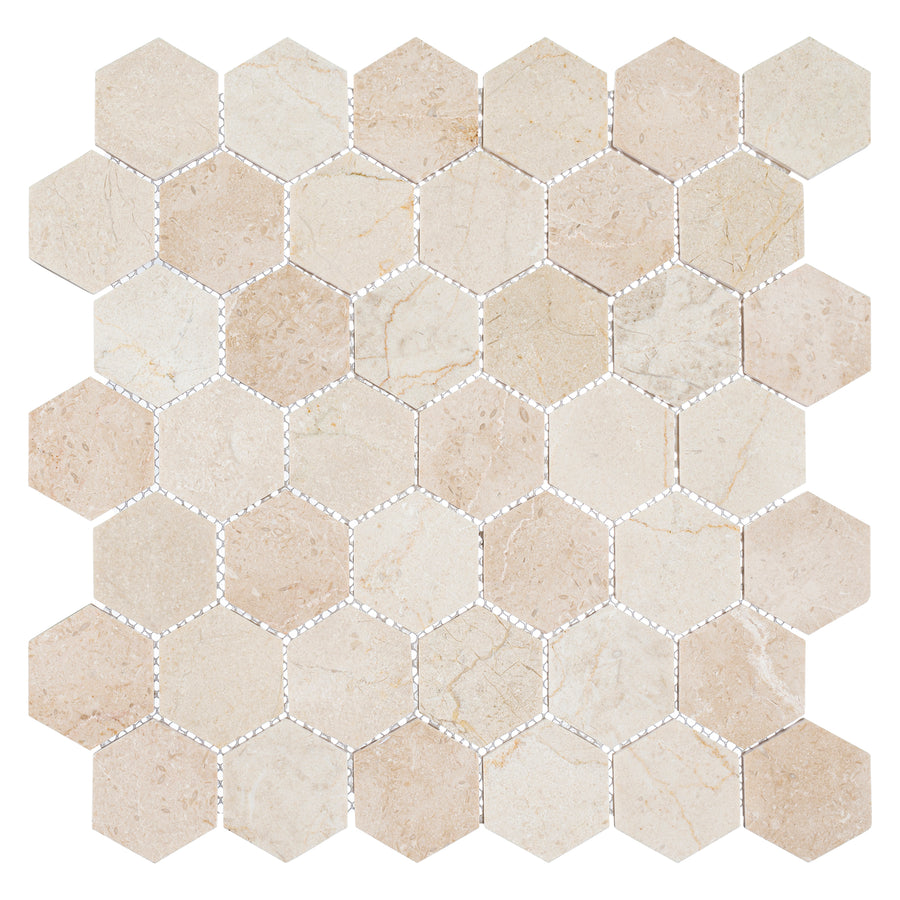 A square sheet of Colonial 2" Hexagon Ceramic Tile in Village Square features hexagonal ceramic tiles with subtle color and veining variations, arranged in a honeycomb pattern and separated by thin white grout lines.