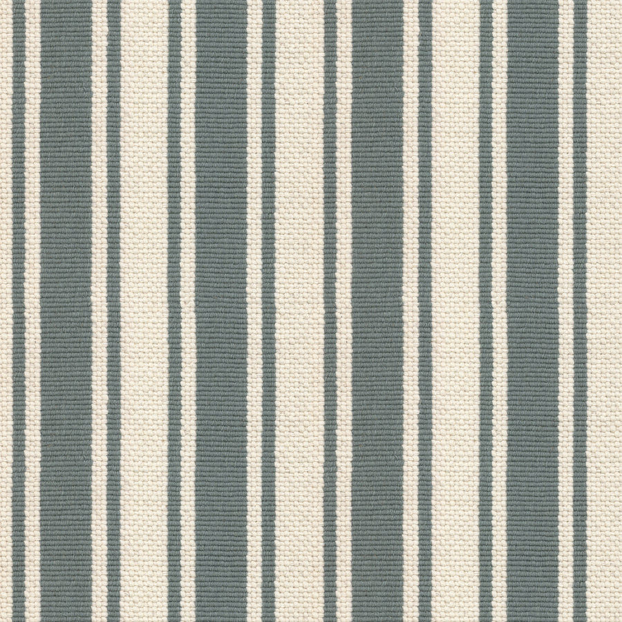 The Cabana On Trend Carpet features alternating vertical stripes in muted blue-gray and off-white, creating a textured, classic look that adds style and simplicity to any room.