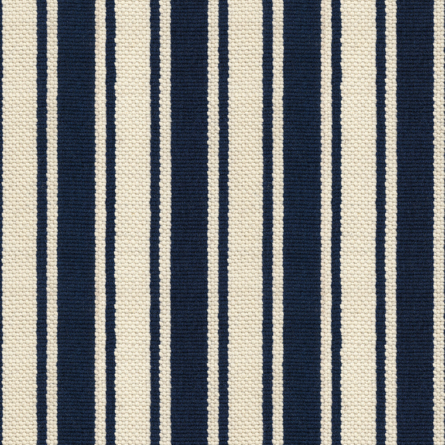 Cabana On Trend Carpet features vertical navy blue and off-white stripes of varying widths, creating a classic, stylish look with a textured finish.