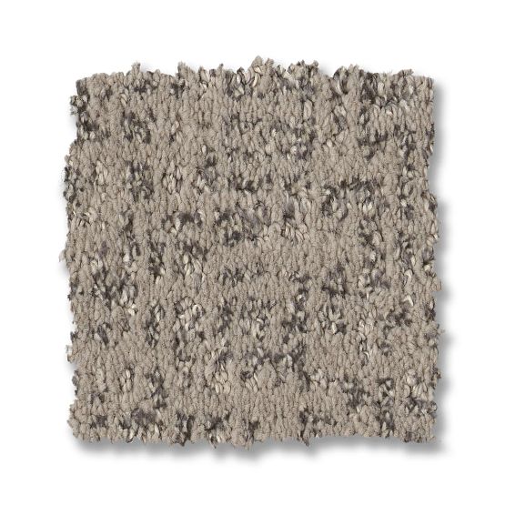 The Caboodle On Trend Carpet in Grounded features a square swatch of plush, speckled light and dark gray fibers with slightly uneven edges, creating a stylish, soft look against a white background.