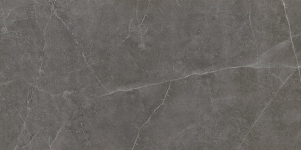 Callie 12x24 Polished Porcelain Tile in Smoke features a dark gray marble-look surface with delicate white veining, natural stone texture, and elegant irregular patterns for a sophisticated finish.