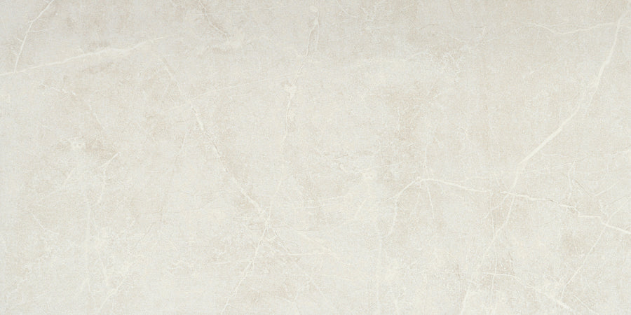 The Callie 12x24 Matte Porcelain Tile in Steel features a smooth, elegant matte finish with subtle white veining and a natural stone texture for a minimalist look.